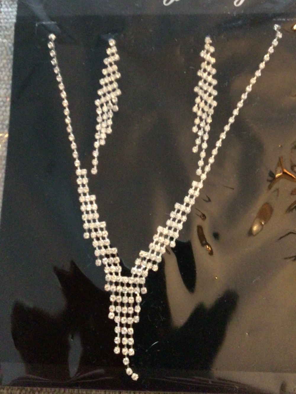 New in package necklace and earring set in rhinestones